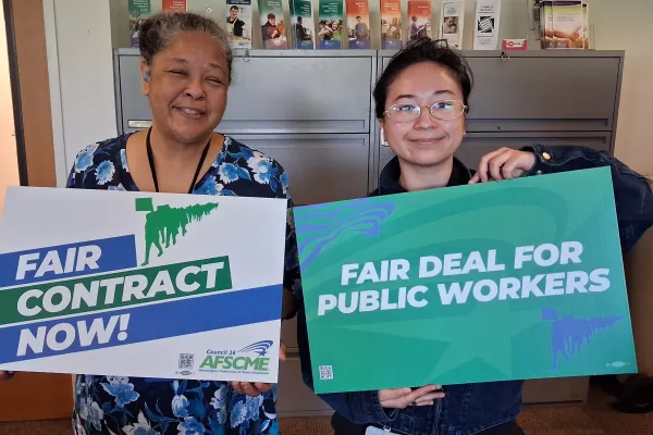 WFSE members with Fair Contract Now signs 6