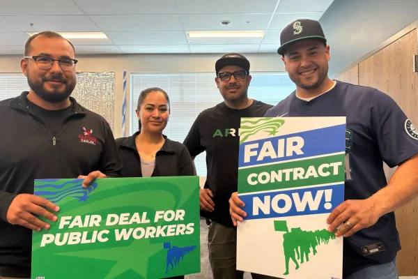 DOC members holding fair contract now signs