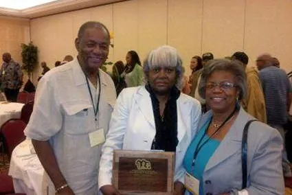 jacquie_award_w_bill_lucy.jpg