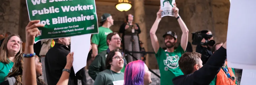 WFSE members hold signs in the State Capitol Building