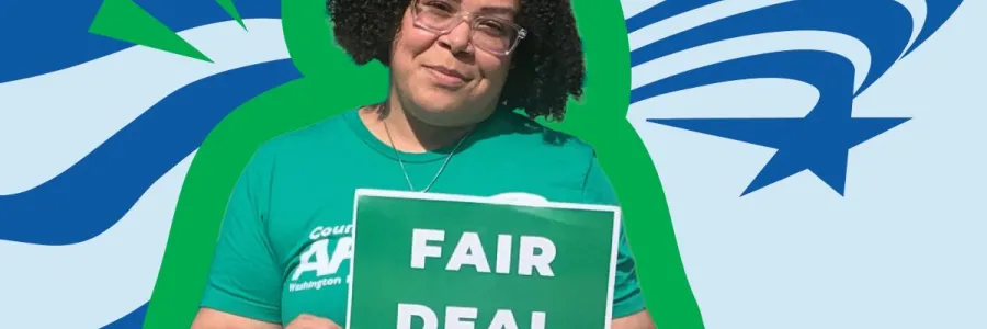 Member holding fair deal for public workers sign