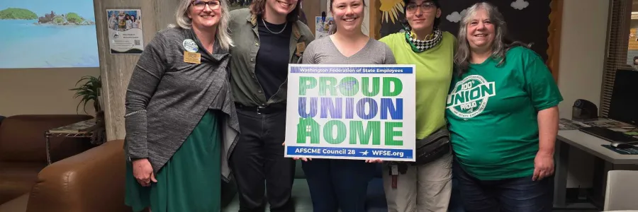 Group photo with "Proud Union Home" sign.