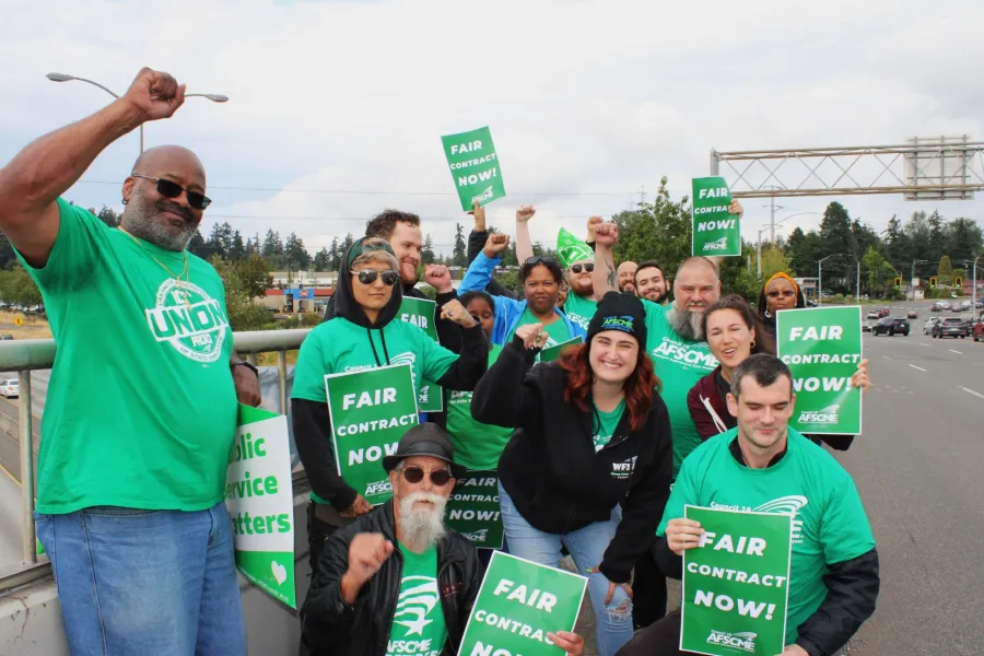 members rallying for union contracts