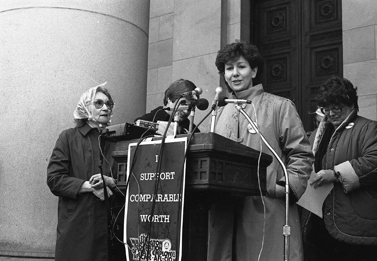 wfse member standing at a podum in front of the WA state capitol 