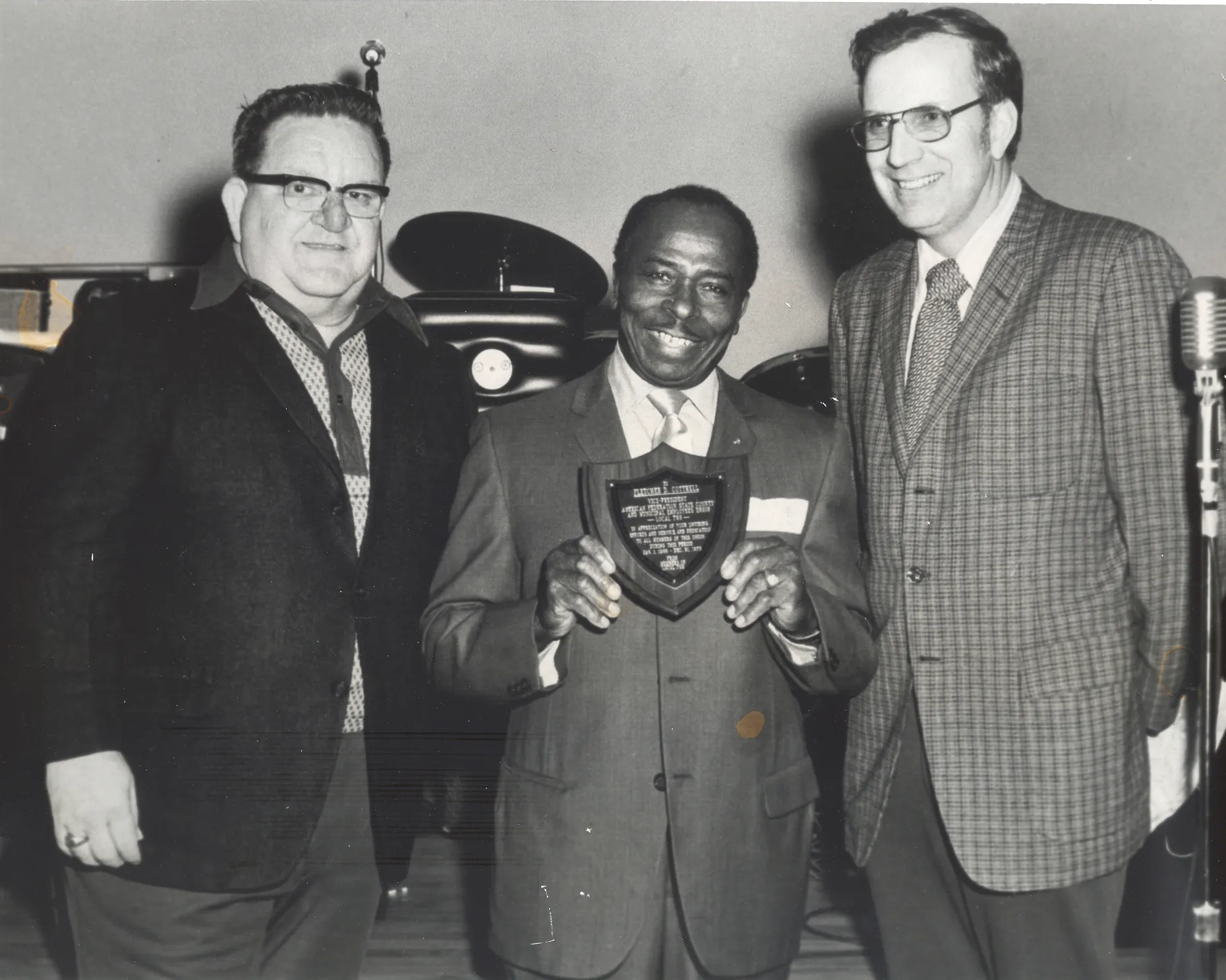 masten right with a member winning an award