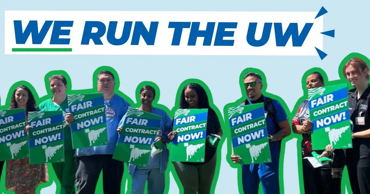 we run the uw members holding signs
