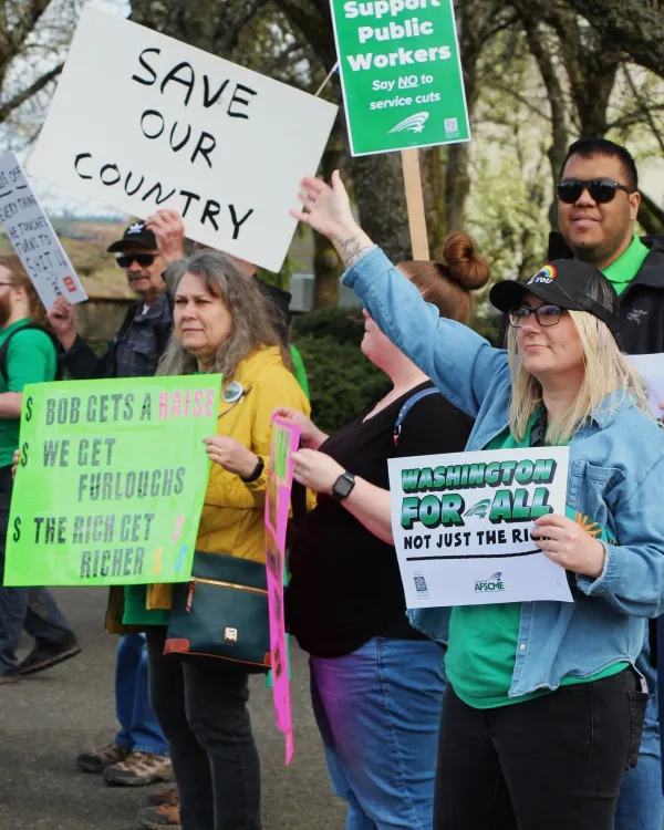 members rallying against furloughs and healthcare cuts