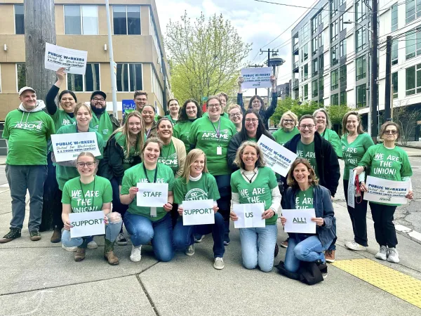 A photo of Seattle-based DCYF members in front of the Space Needle